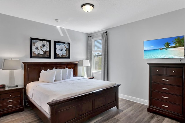 7519 Marker Ave, Kissimmee, FL 34747 - bedroom with baseboards and wood finished floors