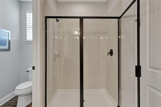 7519 Marker Ave, Kissimmee, FL 34747 - bathroom with a shower stall, baseboards, and toilet