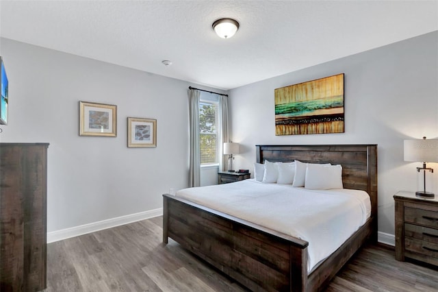 7519 Marker Ave, Kissimmee, FL 34747 - bedroom with baseboards and wood finished floors