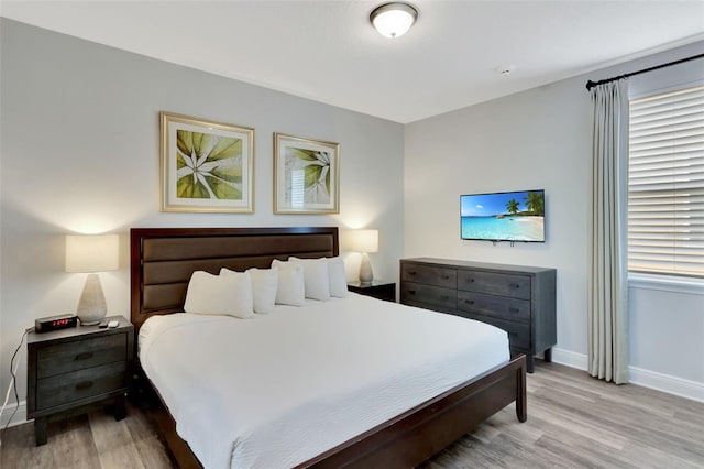7519 Marker Ave, Kissimmee, FL 34747 - bedroom featuring baseboards and light wood-style flooring