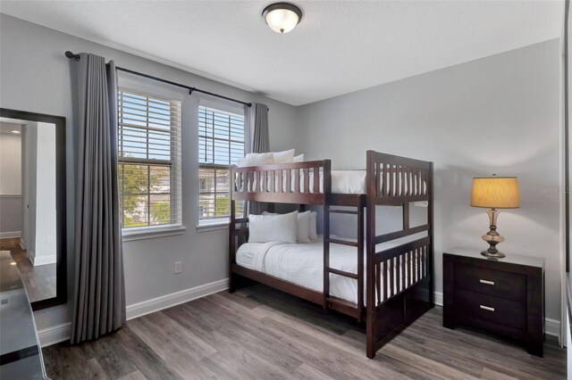 7519 Marker Ave, Kissimmee, FL 34747 - bedroom with baseboards and wood finished floors