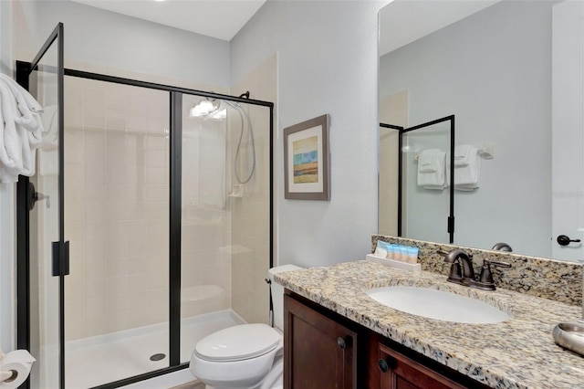 7519 Marker Ave, Kissimmee, FL 34747 - bathroom featuring a shower stall, vanity, and toilet