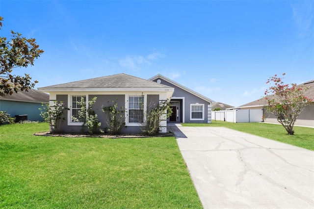 1653 Turtle Rock Dr, Lakeland, FL 33803 - ranch-style house with fence, driveway, a front yard, and stucco siding
