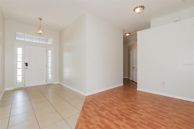 1653 Turtle Rock Dr, Lakeland, FL 33803 - foyer with baseboards and light wood-type flooring