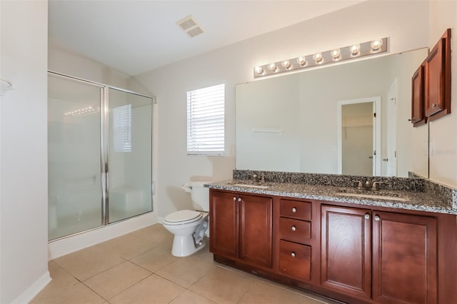 1653 Turtle Rock Dr, Lakeland, FL 33803 - full bath with visible vents, a sink, tile patterned flooring, and a shower stall