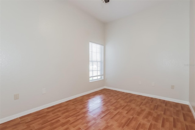 1653 Turtle Rock Dr, Lakeland, FL 33803 - spare room with baseboards and light wood finished floors