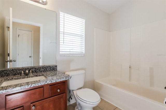 1653 Turtle Rock Dr, Lakeland, FL 33803 - full bathroom featuring vanity, tile patterned floors, bathing tub / shower combination, and toilet