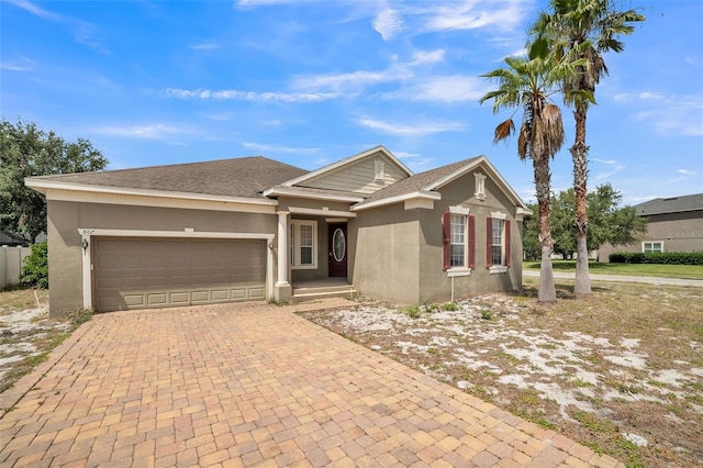 807 Ayden Oak Ln, Ocoee, FL 34761 - single story home with stucco siding, an attached garage, and decorative driveway