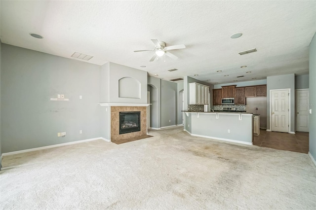 807 Ayden Oak Ln, Ocoee, FL 34761 - unfurnished living room featuring visible vents, a ceiling fan, baseboards, and light carpet