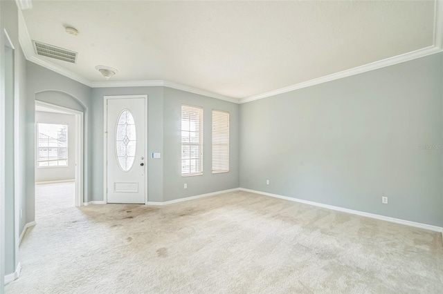 807 Ayden Oak Ln, Ocoee, FL 34761 - entryway with crown molding, baseboards, light colored carpet, and visible vents