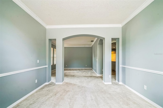 807 Ayden Oak Ln, Ocoee, FL 34761 - empty room featuring crown molding, arched walkways, baseboards, and carpet flooring