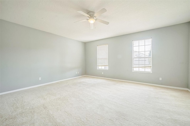 807 Ayden Oak Ln, Ocoee, FL 34761 - unfurnished room featuring baseboards, a ceiling fan, and light colored carpet