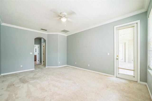 807 Ayden Oak Ln, Ocoee, FL 34761 - carpeted spare room with a ceiling fan, visible vents, arched walkways, baseboards, and ornamental molding