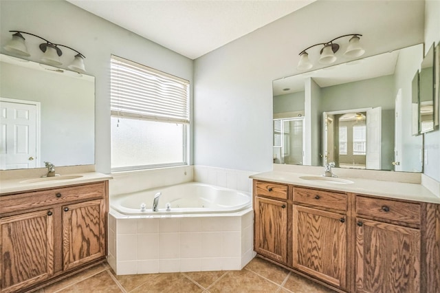 807 Ayden Oak Ln, Ocoee, FL 34761 - bathroom featuring two vanities, a shower stall, a sink, and a bath