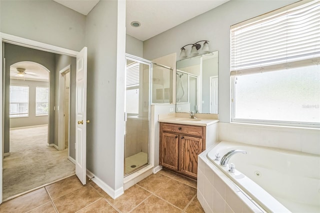 807 Ayden Oak Ln, Ocoee, FL 34761 - bathroom featuring a shower stall, a healthy amount of sunlight, and vanity