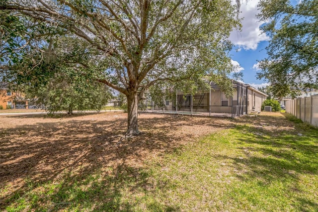 807 Ayden Oak Ln, Ocoee, FL 34761 - view of yard featuring fence and glass enclosure