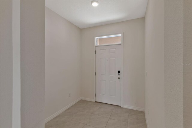 1089 Blue Jay Dr, Davenport, FL 33837 - interior space with baseboards and light tile patterned floors