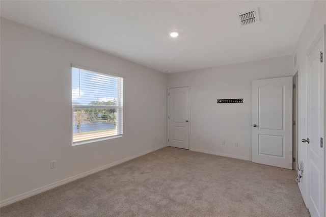 1089 Blue Jay Dr, Davenport, FL 33837 - empty room featuring baseboards, light carpet, and visible vents