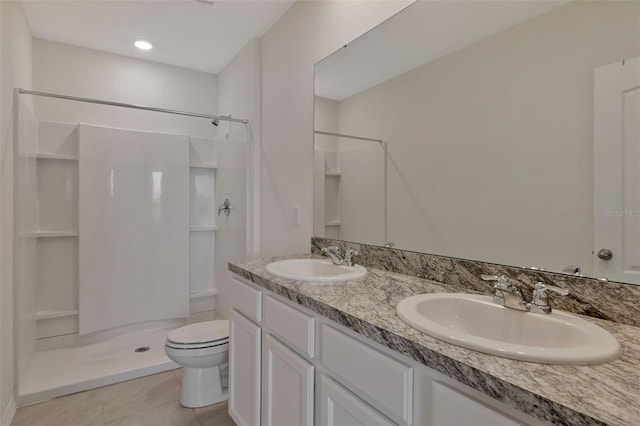 1089 Blue Jay Dr, Davenport, FL 33837 - bathroom featuring a sink, toilet, a shower stall, and tile patterned floors