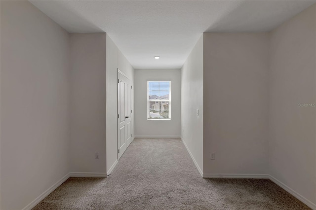 1089 Blue Jay Dr, Davenport, FL 33837 - hallway with baseboards and carpet flooring