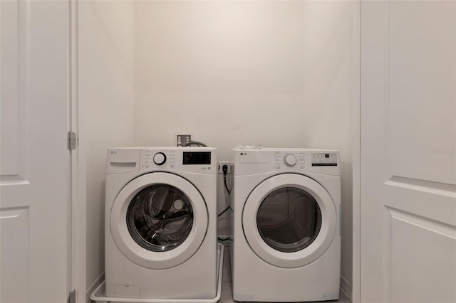 1089 Blue Jay Dr, Davenport, FL 33837 - clothes washing area with washing machine and dryer and laundry area