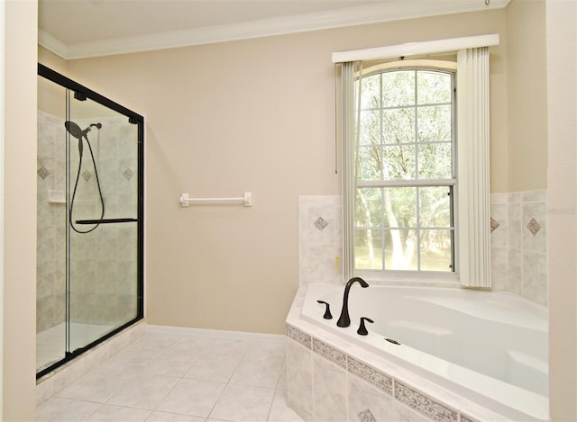 full bathroom with a bath, tile patterned flooring, a stall shower, baseboards, and ornamental molding