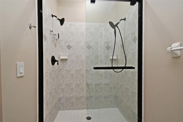 bathroom with a shower stall