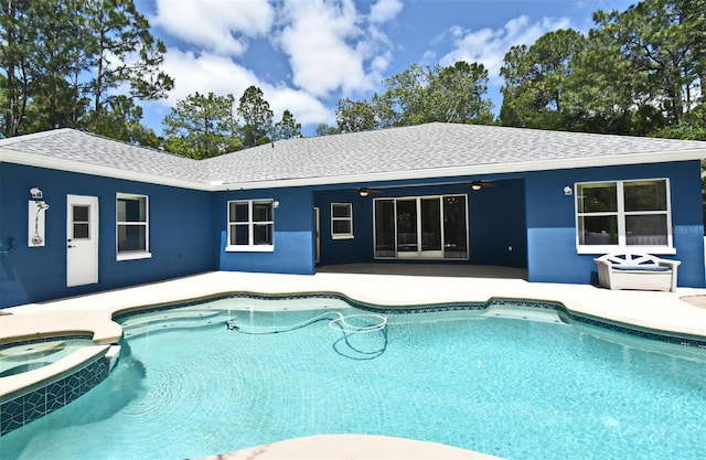 view of pool featuring a ceiling fan, a patio area, and a pool with connected hot tub