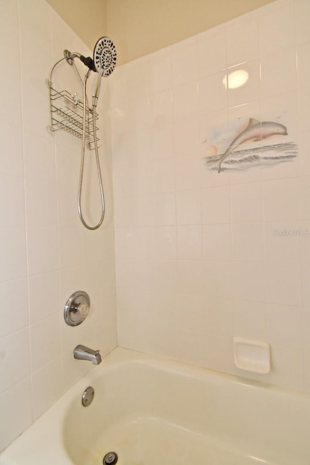 full bath featuring bathing tub / shower combination