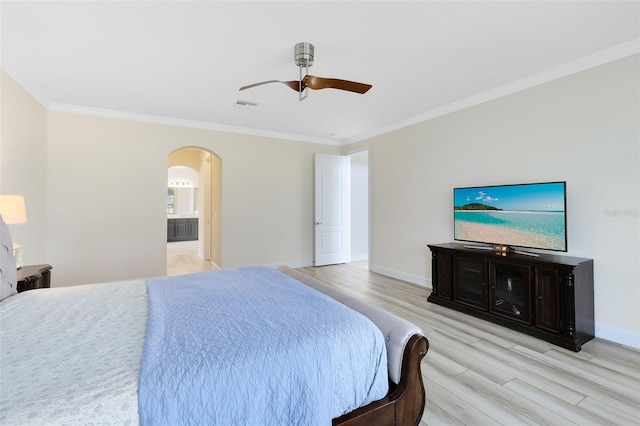 15485 Sandfield Loop, Winter Garden, FL 34787 - bedroom with light wood-style floors, arched walkways, crown molding, baseboards, and a ceiling fan