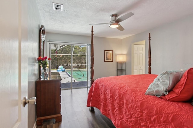bedroom featuring access to outside, a ceiling fan, a textured ceiling, and visible vents