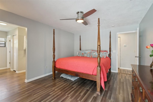 bedroom featuring baseboards, a ceiling fan, and dark wood-style flooring