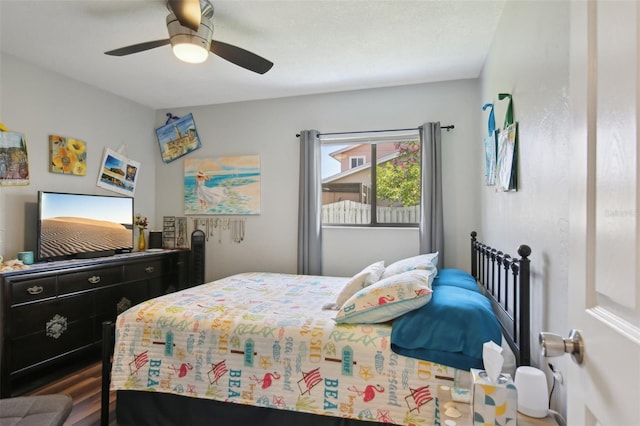 bedroom with ceiling fan and wood finished floors