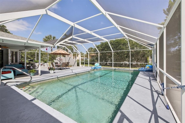 outdoor pool featuring a patio and a lanai