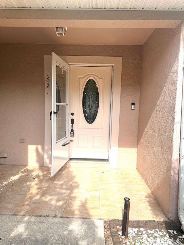 1621 Emily Ct, Kissimmee, FL 34744 - view of exterior entry featuring stucco siding