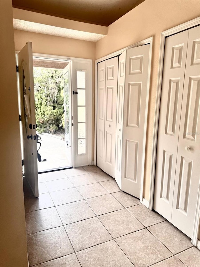 1621 Emily Ct, Kissimmee, FL 34744 - entryway featuring light tile patterned flooring