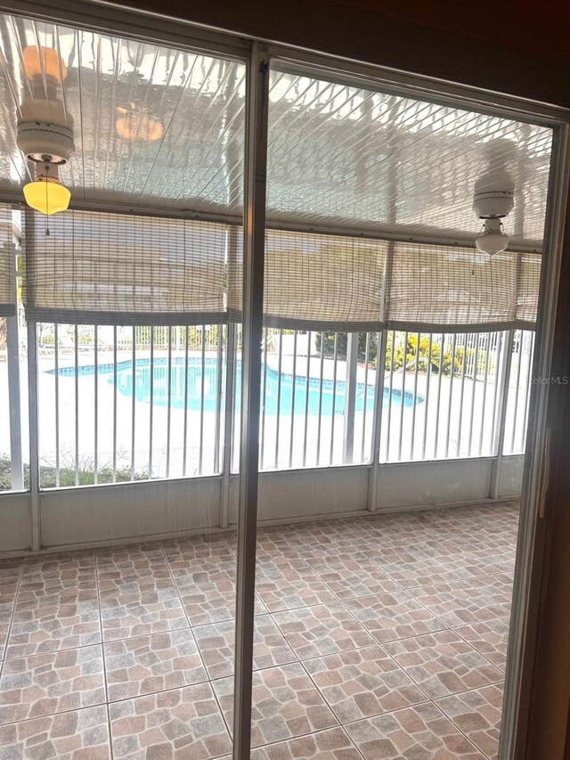 1621 Emily Ct, Kissimmee, FL 34744 - unfurnished sunroom with brick floors