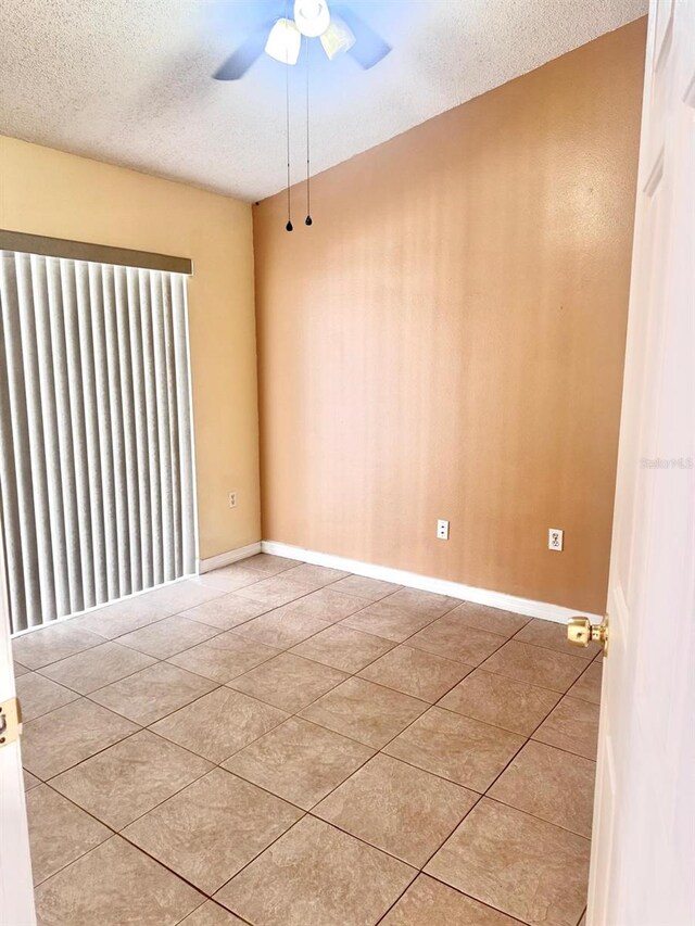 1621 Emily Ct, Kissimmee, FL 34744 - tiled empty room with ceiling fan and a textured ceiling