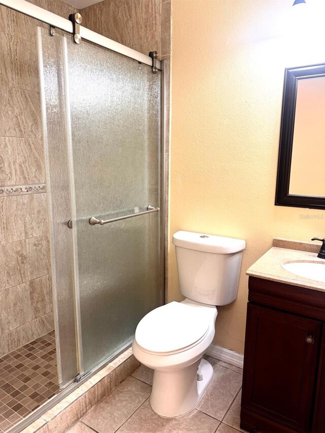 1621 Emily Ct, Kissimmee, FL 34744 - bathroom featuring vanity, a shower stall, and tile patterned flooring