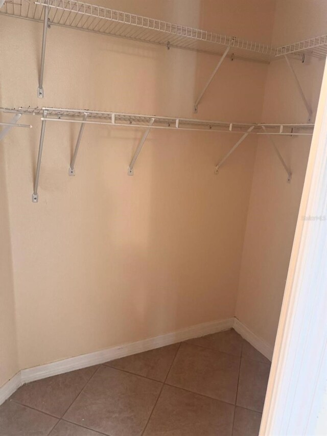 1621 Emily Ct, Kissimmee, FL 34744 - walk in closet with tile patterned flooring