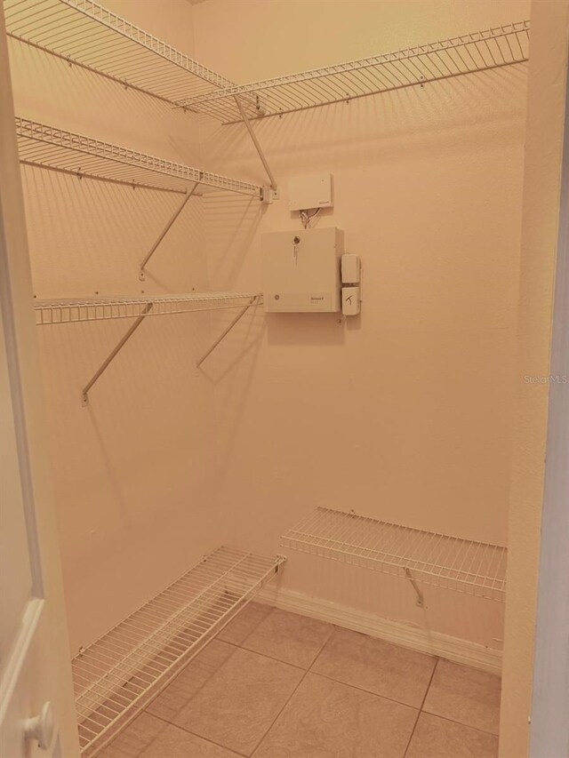 1621 Emily Ct, Kissimmee, FL 34744 - spacious closet with light tile patterned flooring