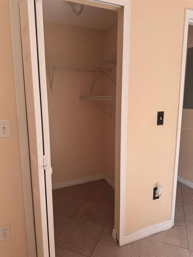 1621 Emily Ct, Kissimmee, FL 34744 - spacious closet with tile patterned floors and electric panel