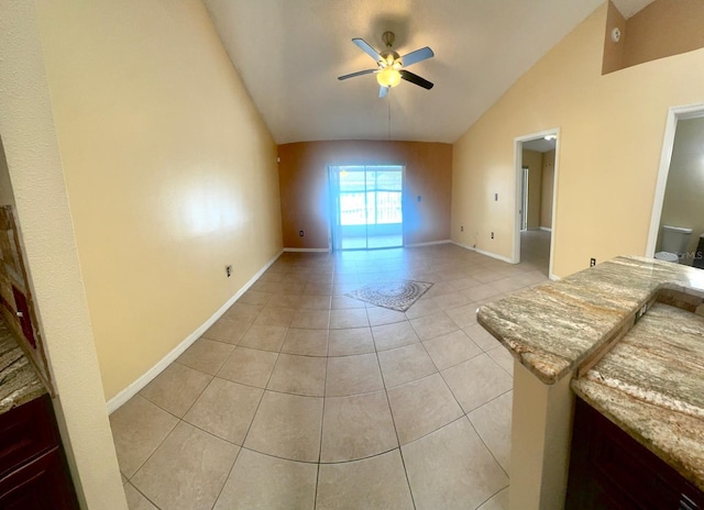1621 Emily Ct, Kissimmee, FL 34744 - unfurnished living room with vaulted ceiling, ceiling fan, and light tile patterned floors
