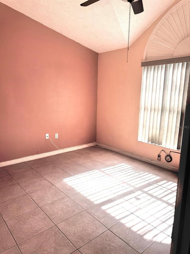 1621 Emily Ct, Kissimmee, FL 34744 - spare room with a ceiling fan, tile patterned flooring, and a textured ceiling