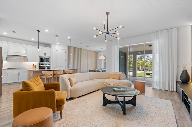 8105 Fenton St, Orlando, FL 32836 - living room featuring light wood-style floors, a chandelier, and recessed lighting