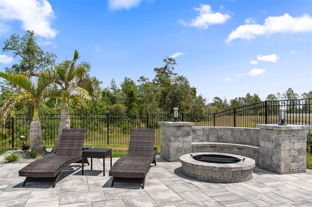 8105 Fenton St, Orlando, FL 32836 - view of patio / terrace featuring an outdoor fire pit and fence