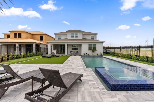 8105 Fenton St, Orlando, FL 32836 - rear view of property featuring a patio, a fenced backyard, a shingled roof, a pool with connected hot tub, and stucco siding