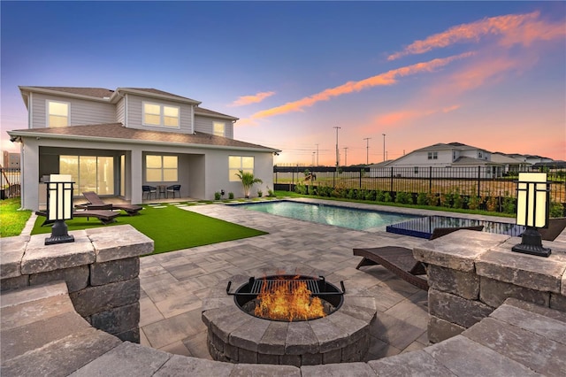 8105 Fenton St, Orlando, FL 32836 - view of swimming pool with a fire pit, a patio, and a fenced backyard