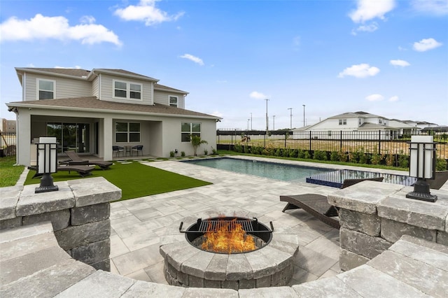 8105 Fenton St, Orlando, FL 32836 - view of pool featuring a fire pit, a patio area, and a fenced backyard