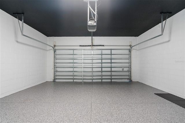8105 Fenton St, Orlando, FL 32836 - garage with concrete block wall and a garage door opener